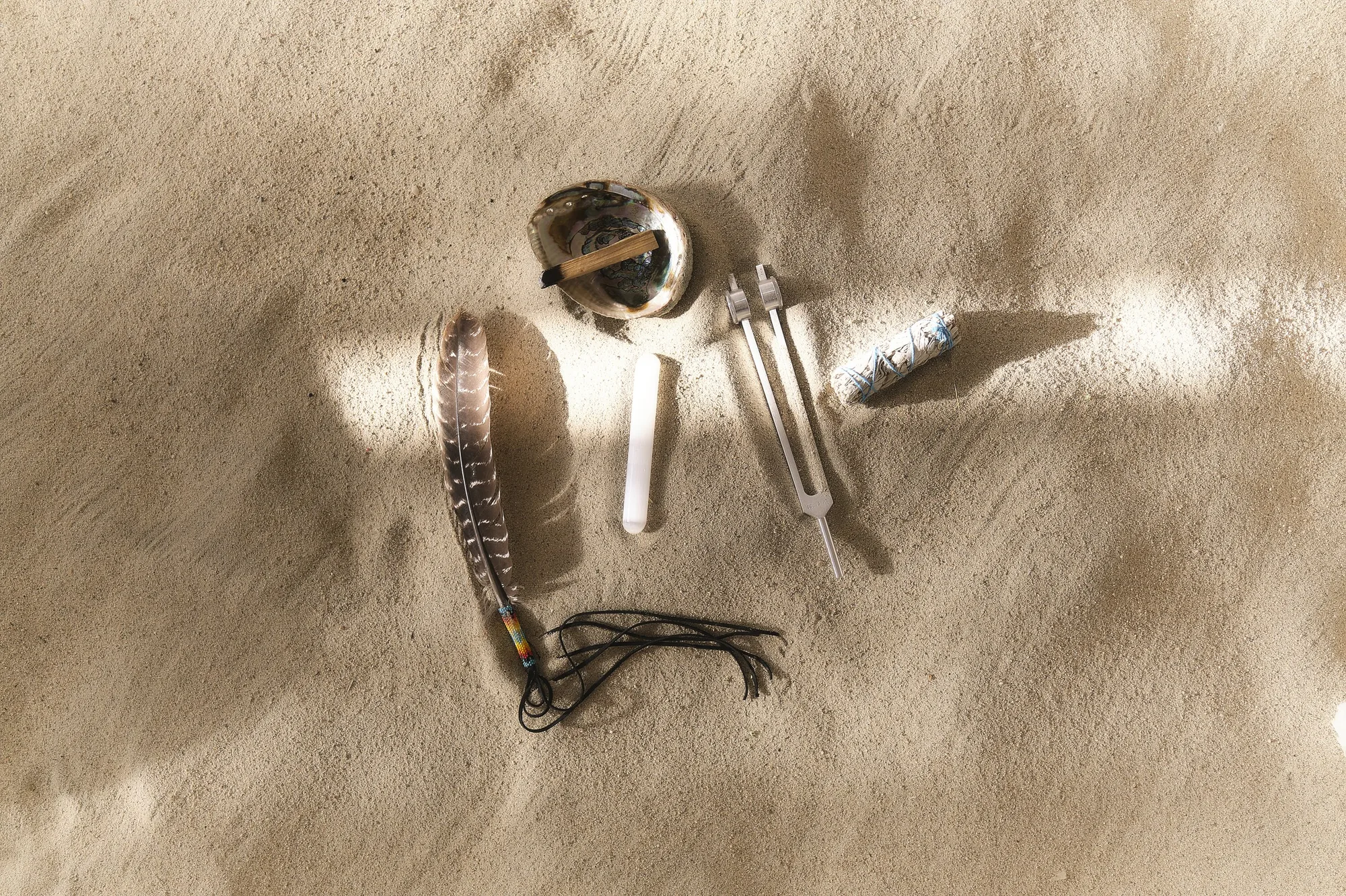 Breathwork tools laid on the sand